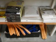 A quantity of Dunhelm bed linen and a quantity of coat hangers