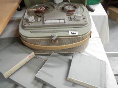 A reel to reel tape recorder and tapes