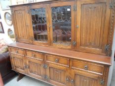 An oak Priory style dresser