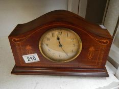 An inlaid mantel clock