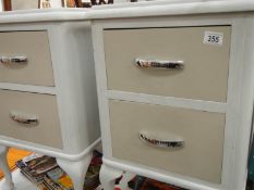 A pair of shabby chic painted bedside cabinets