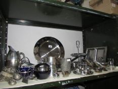 A shelf of metal ware