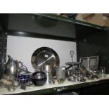 A shelf of metal ware