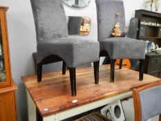 A modern rustic style dining table and 4 upholstered dining chairs