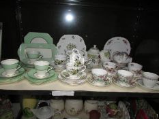 A shelf of assorted tea ware