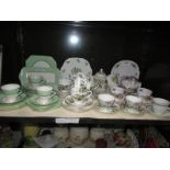 A shelf of assorted tea ware