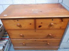A pine 2 over 3 chest of drawers