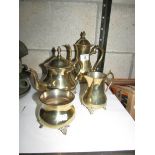 A brass 4 piece tea set