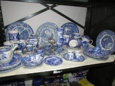 A shelf of blue and white table ware,
