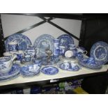 A shelf of blue and white table ware,