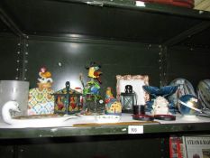 A shelf of miscellaneous ornaments etc