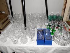 A mixed lot of glass ware including champagne flutes,