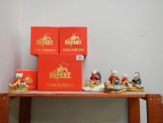 A collection of 4 Arden Rupert the Bear figurines (all boxed)