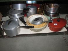 A mixed lot of mixing bowls, pots and pans etc, one shelf