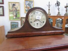 An oak 8 day mantel clock