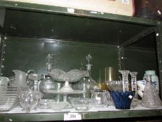 A mixed lot of glass ware including cake stands, one shelf
