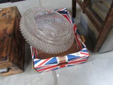 A large glass lamp shade