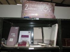 A quantity of new bed linen and pillows