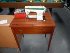A Singer sewing machine, model 257,