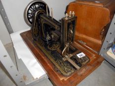 A cased vintage sewing machine