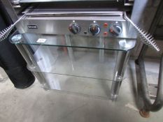 A glass and chrome TV stand