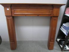 A stained wood fire surround