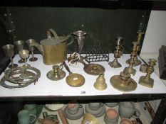 A mixed lot of brass ware including candlesticks, one shelf