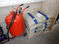 A 20 gallon portable sand blaster with 10 x 25kg bags of medium grade crushed glass blast media