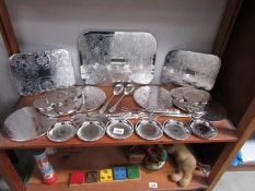 A mixed lot of silver coloured place mats and coasters,