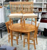 An extending dining table & 4 chairs