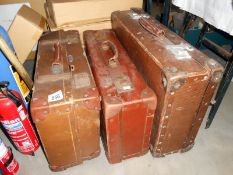 3 vintage suitcases