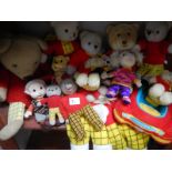 A collection of vintage and soft Rupert the Bear toys