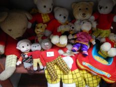 A collection of vintage and soft Rupert the Bear toys