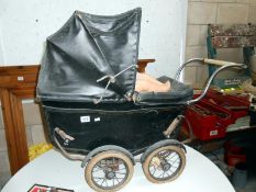 A vintage dolls pram and doll (in need of some tlc)