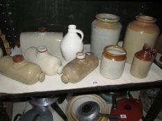 A mixed lot of stoneware including hot water bottles, one shelf