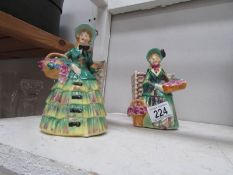 A pair of figural posy vases