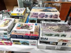 A collection of 23 boxed model kits being tanks and military vehicles