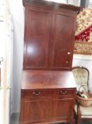 A mahogany bureau book case