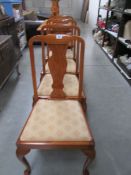 A set of 4 walnut dining chairs