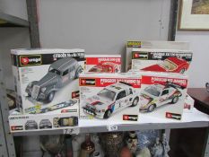 11 boxed Burago metal model car kits