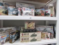 A collection of 26 boxed model kits including Tamiya, Airfix, Matchbox, Heuer,