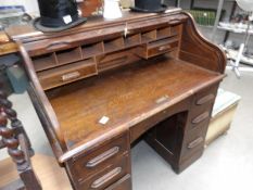 An oak roll top desk