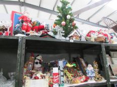 A large quantity of assorted Christmas decorations (2 shelves)