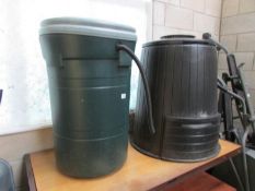 A water barrel and a compost barrel