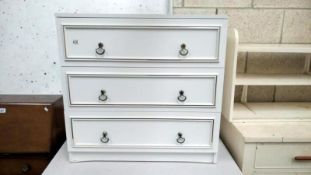 A white 3 drawer chest