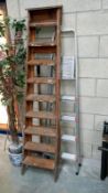 A wooden step ladder and an aluminium step ladder