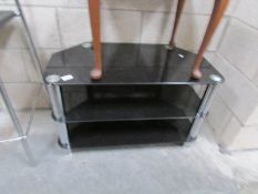 A black glass television stand