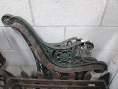 A pair of cast iron bench ends