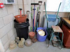 A mixed lot of garden tools, wheel barrow,