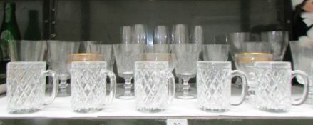 A shelf of drinking glasses